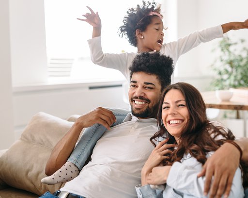 happy family sitting on a couch